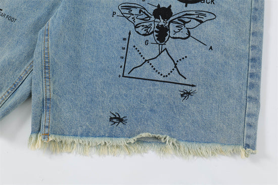 Men's printed denim shorts by MONO//FIT with graphic designs and frayed hem for a stylish look