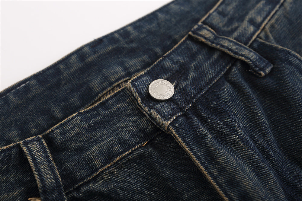 Close-up of MONO//FIT men's straight jeans fashion featuring a detailed waistband and button design
