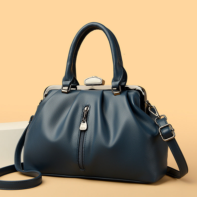 Stylish dark blue minimalist women handbag with a zipper and adjustable strap