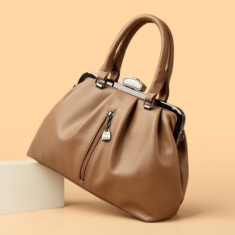 Stylish minimalist women handbag in brown with a structured design and zipper detail