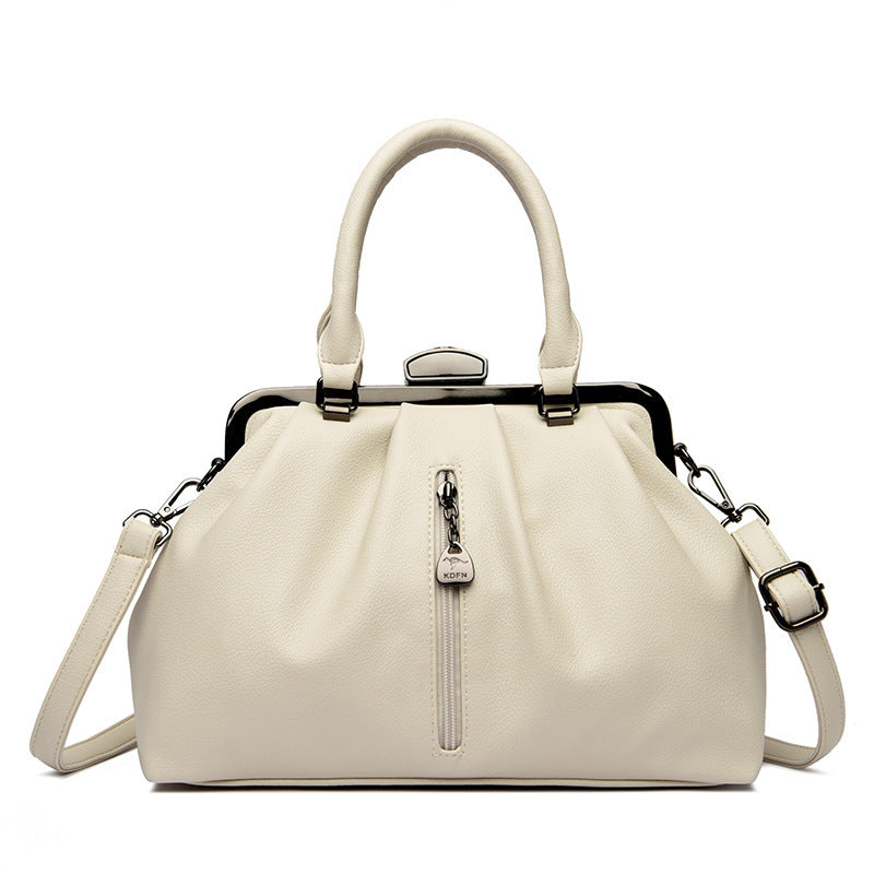 Elegant minimalist women handbag in cream with top handles and detachable shoulder strap