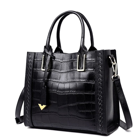 MONO//FIT pattern woven leather handbag in black with elegant design and adjustable strap