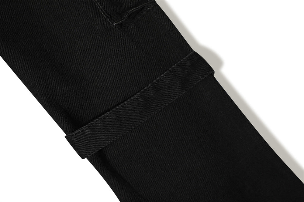 MONO//FIT punk flared jeans men featuring a stylish black design with unique rolled cuffs