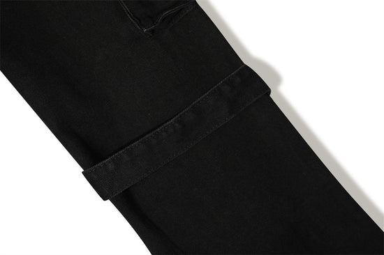 MONO//FIT punk flared jeans men featuring a stylish black design with unique rolled cuffs