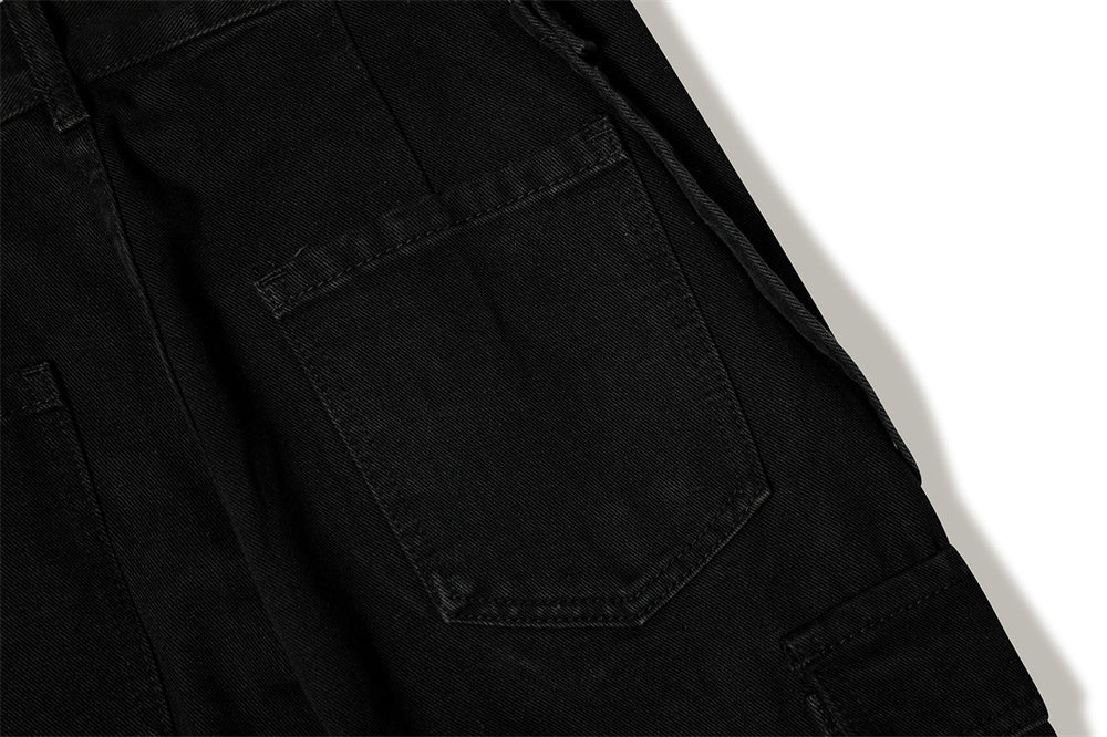 Close-up of MONO//FIT punk flared jeans men with black fabric and unique pocket design