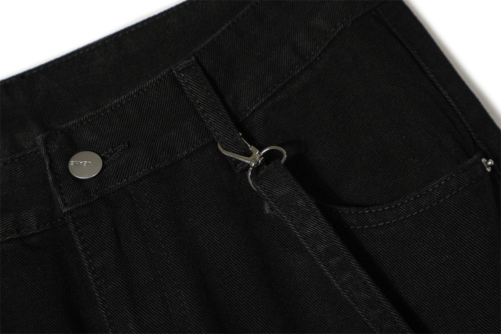Close-up of MONO//FIT punk flared jeans men showcasing zipper detail and stylish black fabric