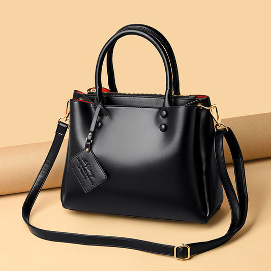 MONO//FIT simple design tote bags in sleek black with top handles and adjustable strap