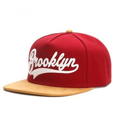 Red sport cap for men with Brooklyn embroidery and a tan brim for a stylish look