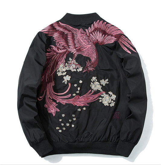 Stylish embroidered bomber jacket with a vibrant phoenix design and floral details on a black background