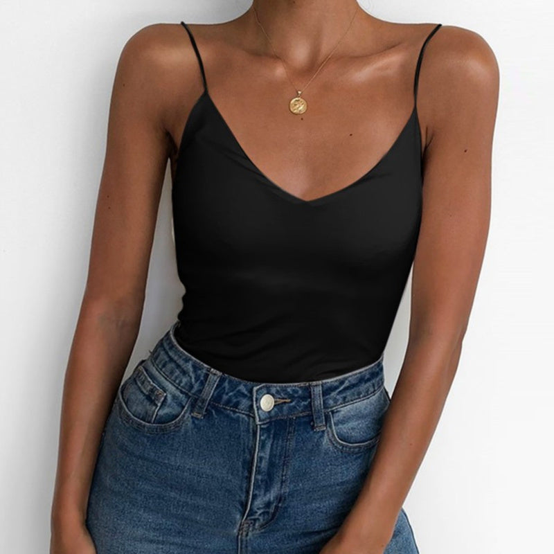 Stylish satin camisole for women in black paired with high-waisted denim jeans