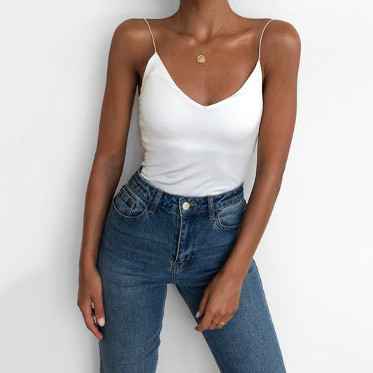 Stylish satin camisole for women in white paired with high-waisted jeans for a chic look