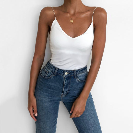 Stylish satin camisole for women in white paired with high-waisted jeans for a chic look
