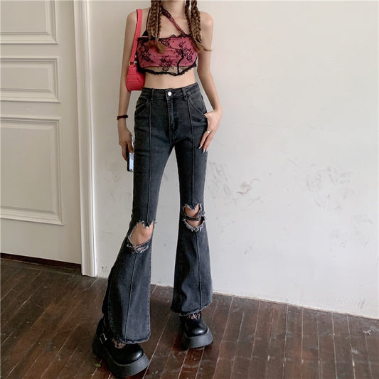Trendy ripped jeans women with flared legs and distressed details for a stylish look