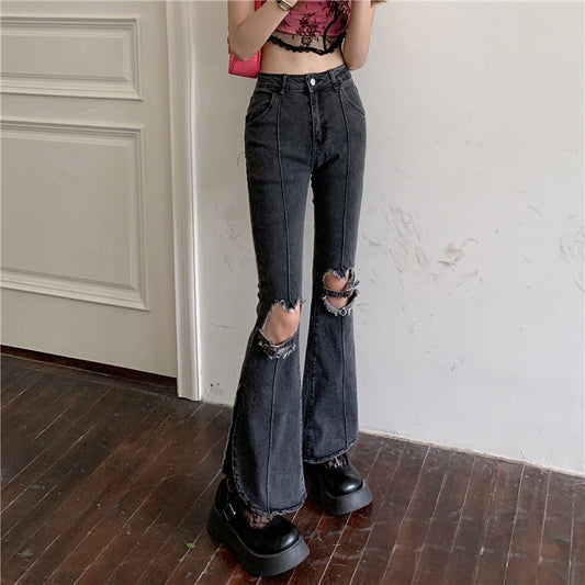 Trendy ripped jeans women in black with a flared fit and distressed details for a modern look