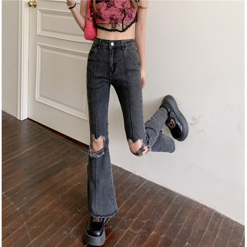 Trendy ripped jeans women in black with flared bottom and distressed details, perfect for casual outfits