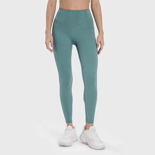 Women's fitness tights in teal with a high waistband for comfort and support during workouts