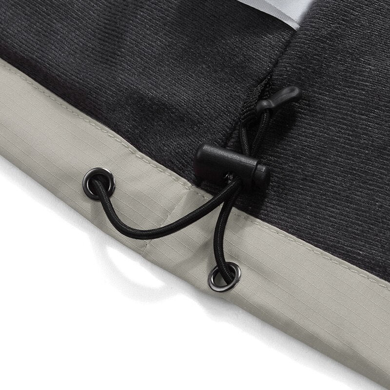 Detail of MONO//FIT waterproof jacket for winter featuring adjustable drawstring hem for a snug fit