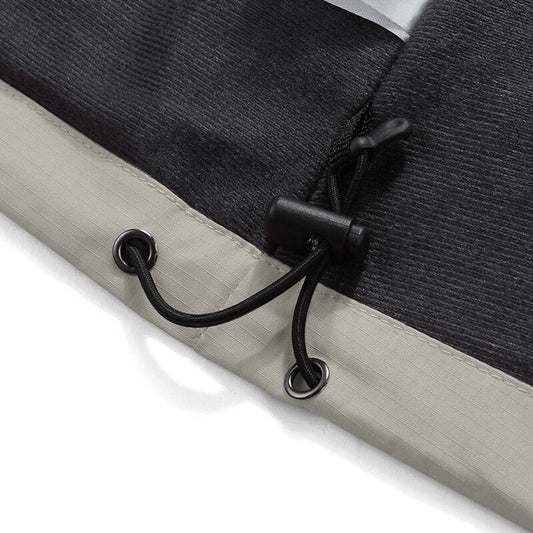 Detail of MONO//FIT waterproof jacket for winter featuring adjustable drawstring hem for a snug fit