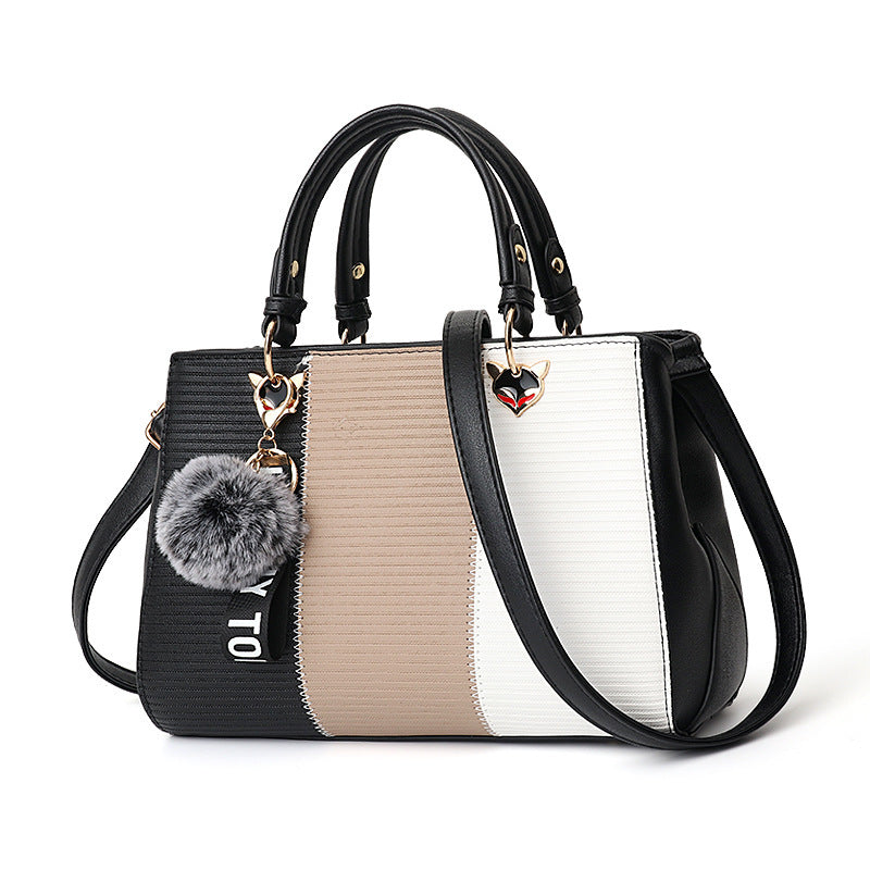 MONO//FIT women's crossbody shoulder bag with stylish color-block design and detachable pom-pom charm