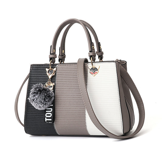 MONO//FIT stylish women's crossbody shoulder bag in a modern design with playful charm