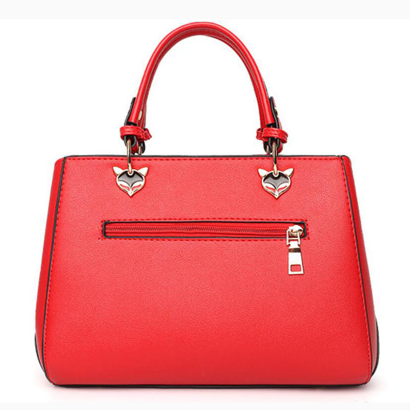 MONO//FIT red handbag featuring metallic fox accents, ideal as a women's crossbody shoulder bag
