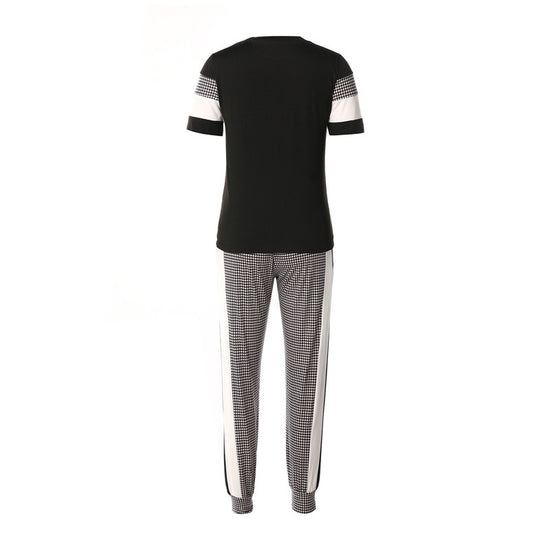 MONO//FIT women's fashion sets featuring a stylish black top and patterned pants with side stripes
