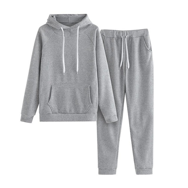 MONO//FIT women's fitness sets in grey featuring a comfortable hooded sweatshirt and matching jogger pants