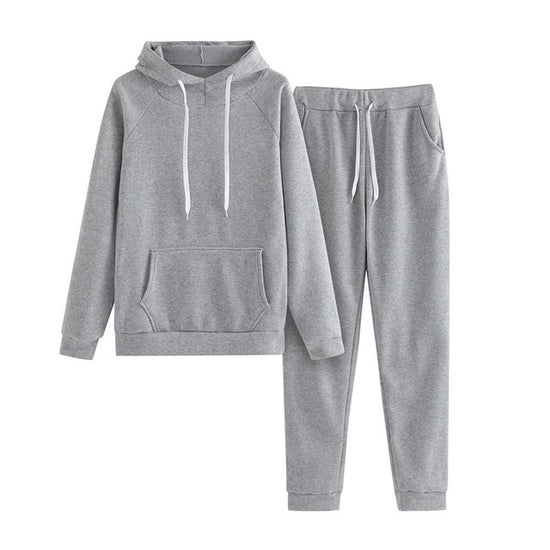MONO//FIT women's fitness sets in grey featuring a comfortable hooded sweatshirt and matching jogger pants