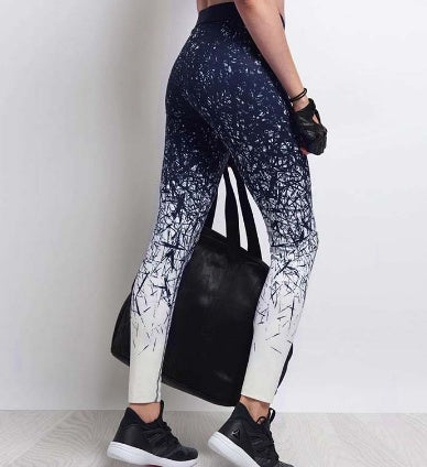Stylish women's fitness yoga pants in a black and white design, perfect for workouts